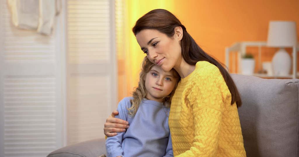 A protective parent providing emotional support to a child after experiencing coercive control and parental manipulation.